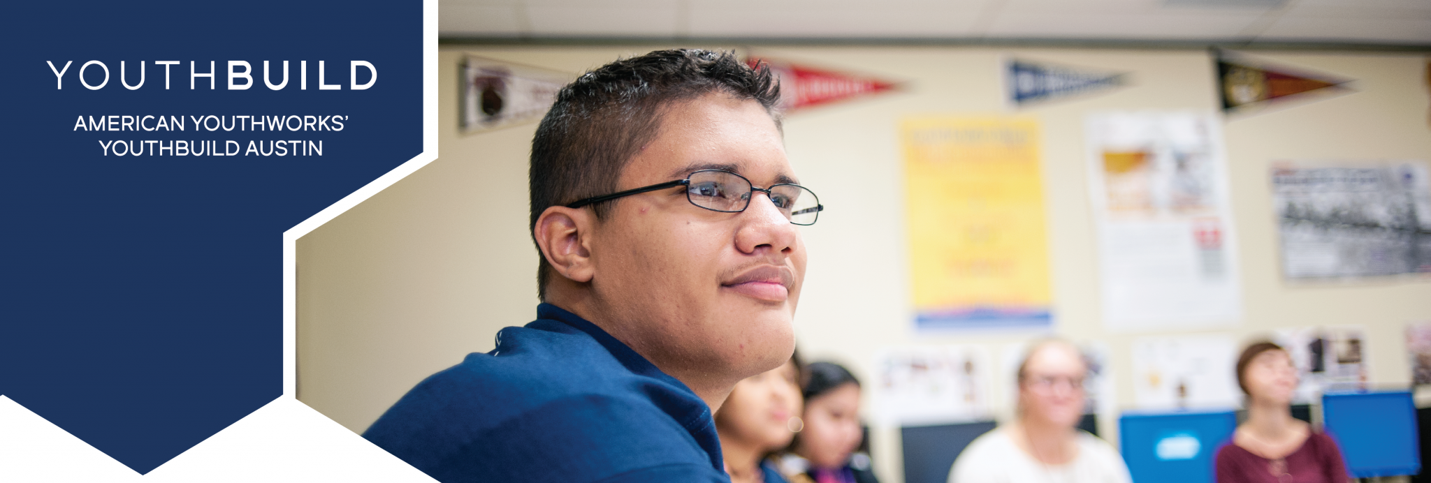 The YouthBuild Austin logo, and a close up of a participant in a classroom.