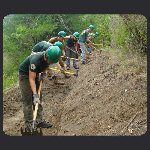 Early TXCC participants building a trail.